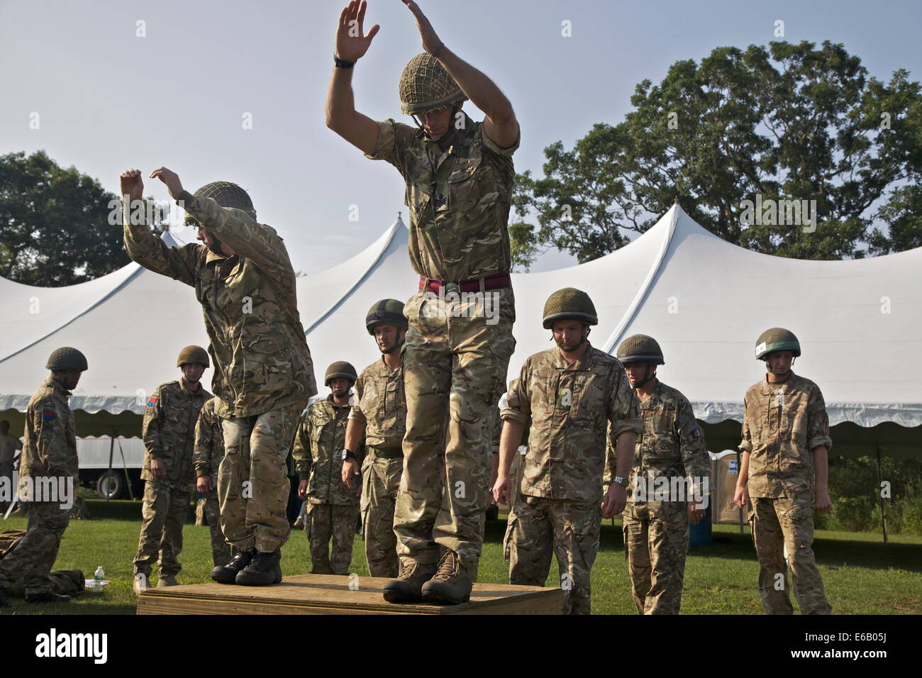 British military paratroopers conduct proper parachute landing techniques during Leapfest XXXI in West Kingston, R.I., July 30, Stock Photo