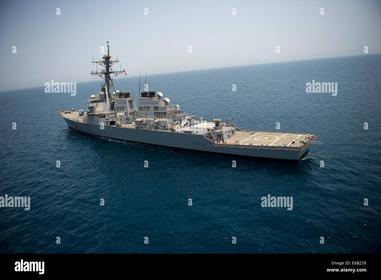 The guided missile destroyer USS Arleigh Burke (DDG 51) transits the Persian Gulf Aug. 2, 2014. The Arleigh Burke was deployed in the U.S. 5th Fleet area of responsibility supporting maritime security operations and theater security cooperation efforts. Stock Photo
