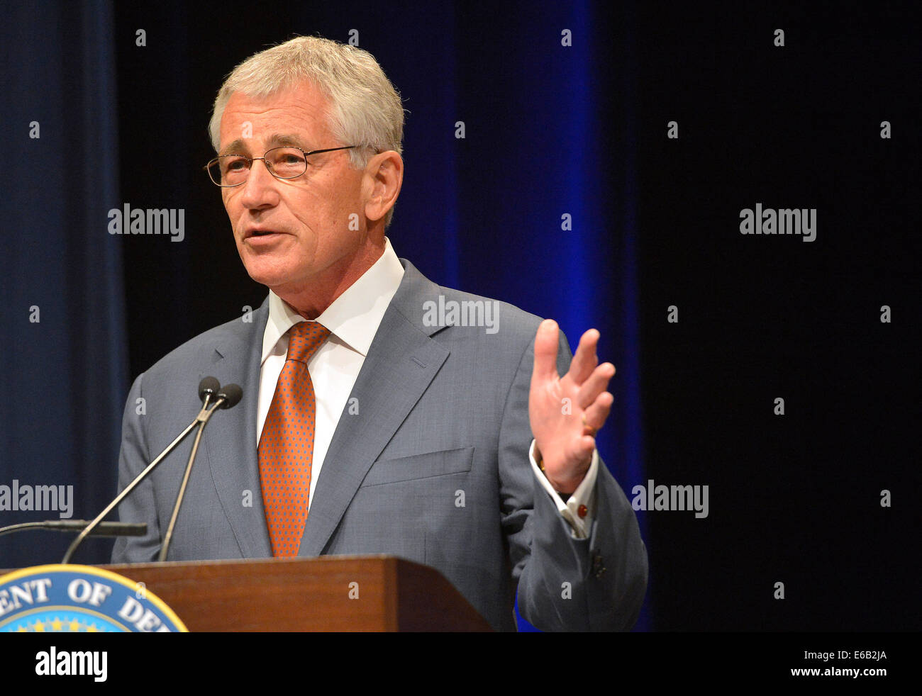 Secretary of Defense Chuck Hagel delivers remarks during a welcome ceremony Aug. 4, 2014, at the Pentagon in Arlington, Va. During the event, Hagel formally commissioned Undersecretary of Defense for Policy Christine Wormuth, Undersecretary of Defense (Co Stock Photo