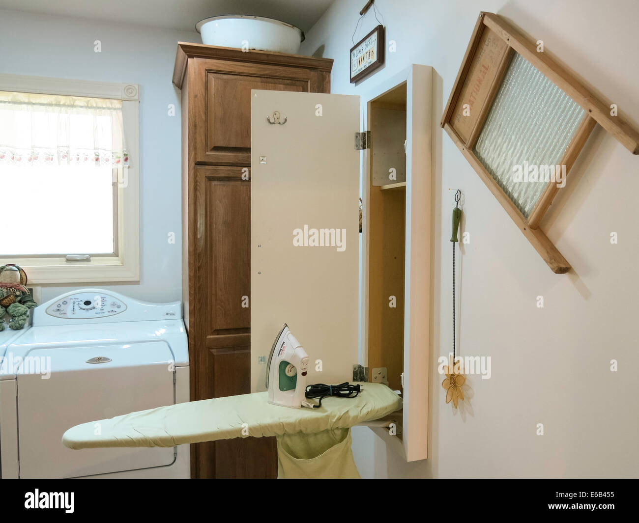 Contemporary Laundry Room with Drop-down Ironing Board and Western ...