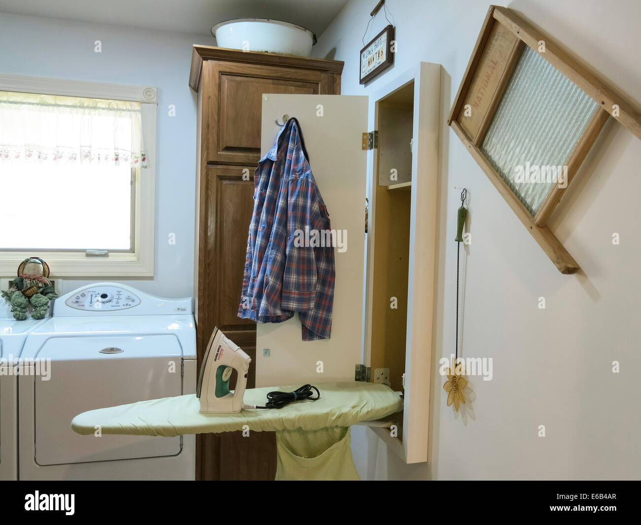 Contemporary Laundry Room with Drop-down Ironing Board and Western ...