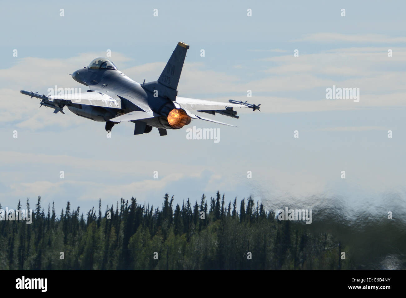 A U.S. Air Force F-16 Fighting Falcon aircraft assigned to the 14th Fighter Squadron takes off Aug. 8, 2014, during Red Flag-Alaska 14-3 at Eielson Air Force Base, Alaska. Red Flag-Alaska is a series of Pacific Air Forces commander-directed field training Stock Photo