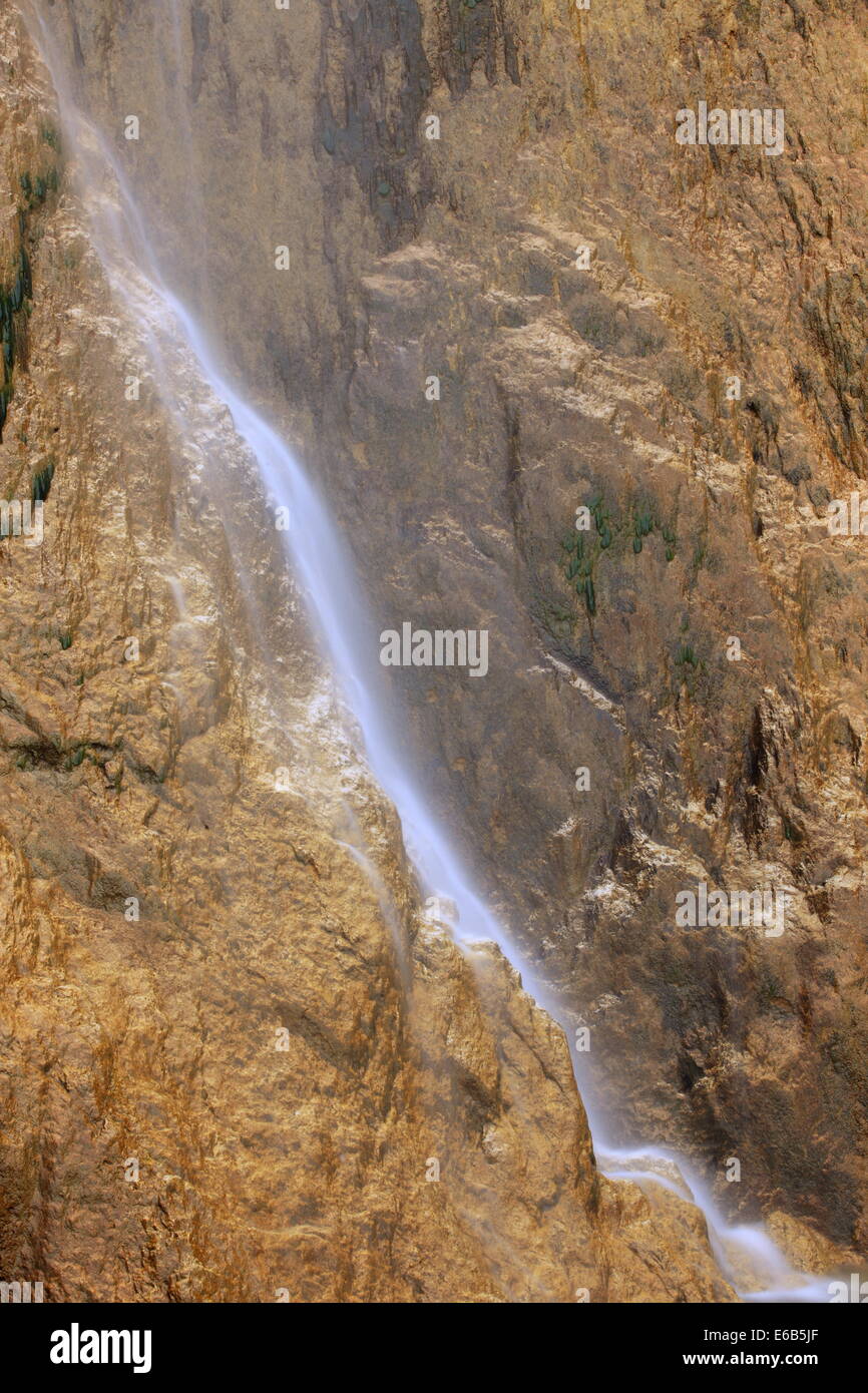 Waterfall in golden rocks aspect. Stock Photo
