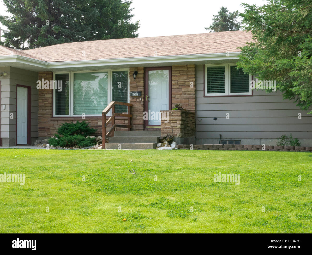 Residential House Exterior in Middle Class Neighborhood, MT, USA Stock