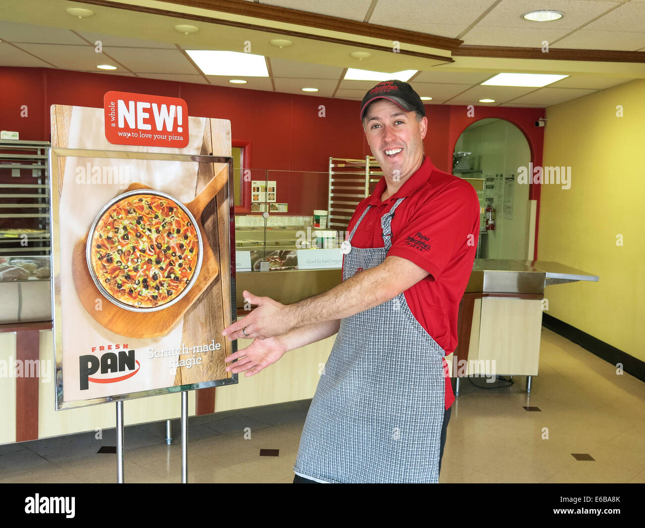 Small Business Owner of Pizza Shop with Instore Feature Ad, USA Stock Photo