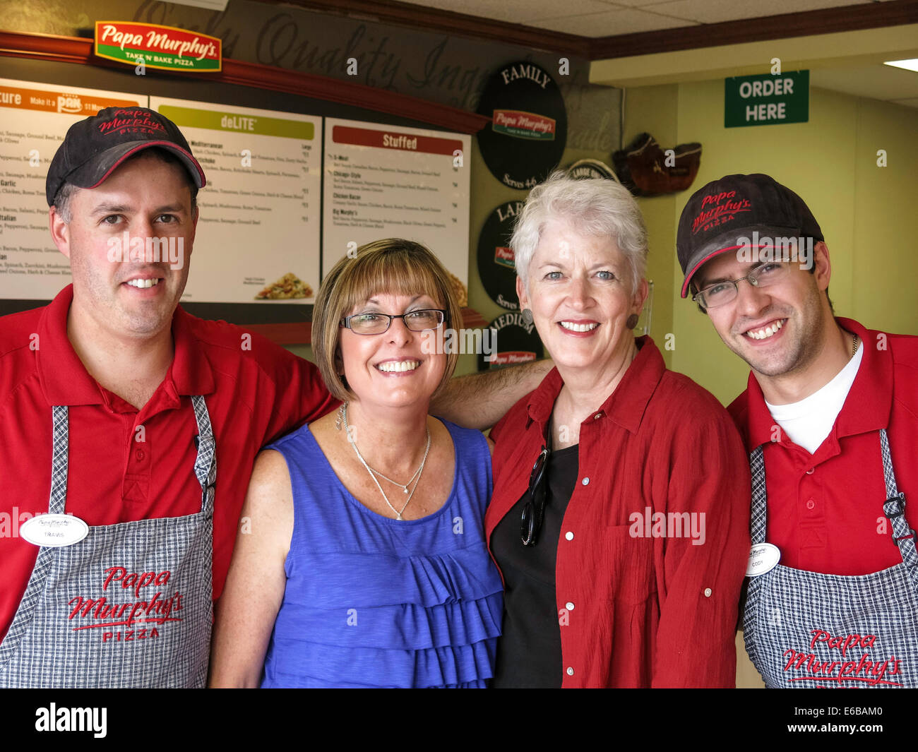 Satisfied Customer with Small Business Owners of Pizza Shop, USA Stock Photo
