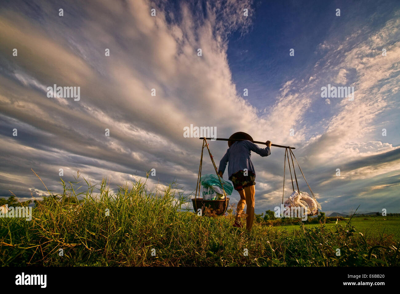 a women with a burden Stock Photo