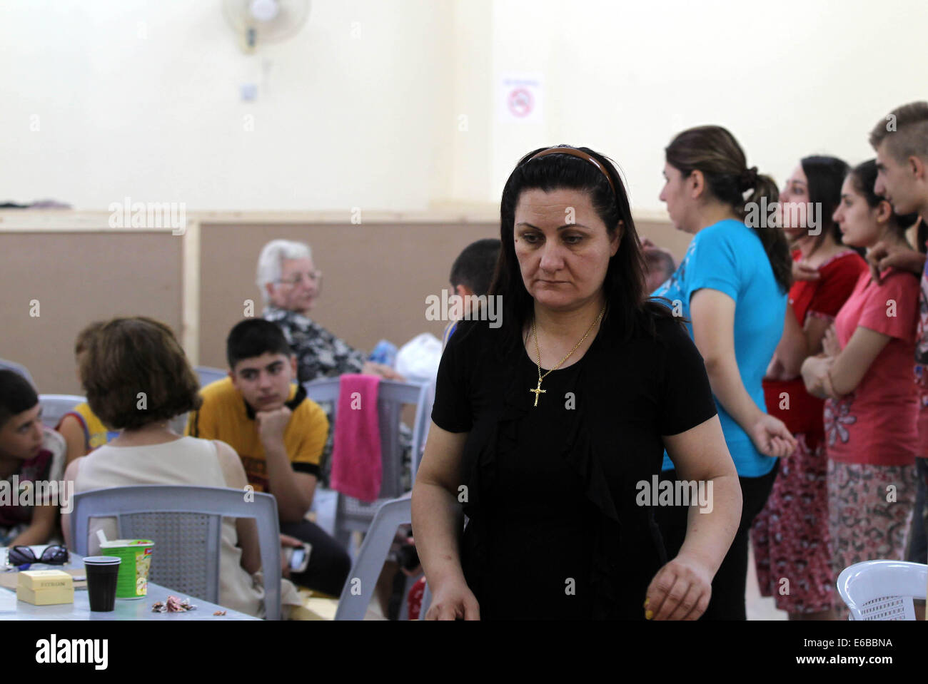 (140819)-- AMMAN, Aug. 19, 2014 (Xinhua)-- Iraqi Christian refugees, who fled the violence to Jordan, stay at Dar Al Salam Association in Amman, Jordan on Aug. 19, 2014. Iraqi Christian families sought sanctuary in Jordan after fleeing towns and villages to escape the advance of Islamic State militants. (Xinhua/Mohammad Abu Ghosh) Stock Photo