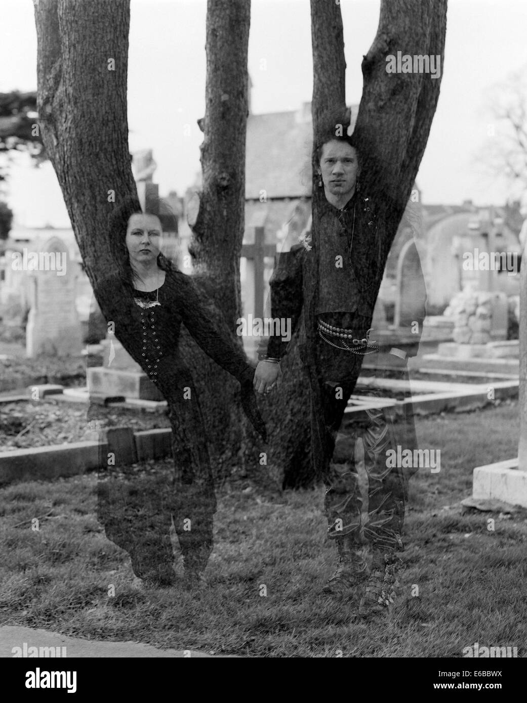 young fashionable goths dressed in black in a church graveyard portsmouth uk Stock Photo
