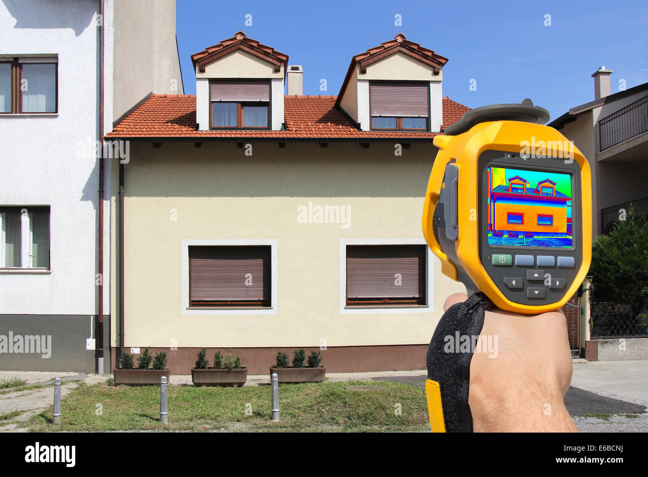 Recording Heat Loss at the House With Infrared Thermal Camera Stock Photo