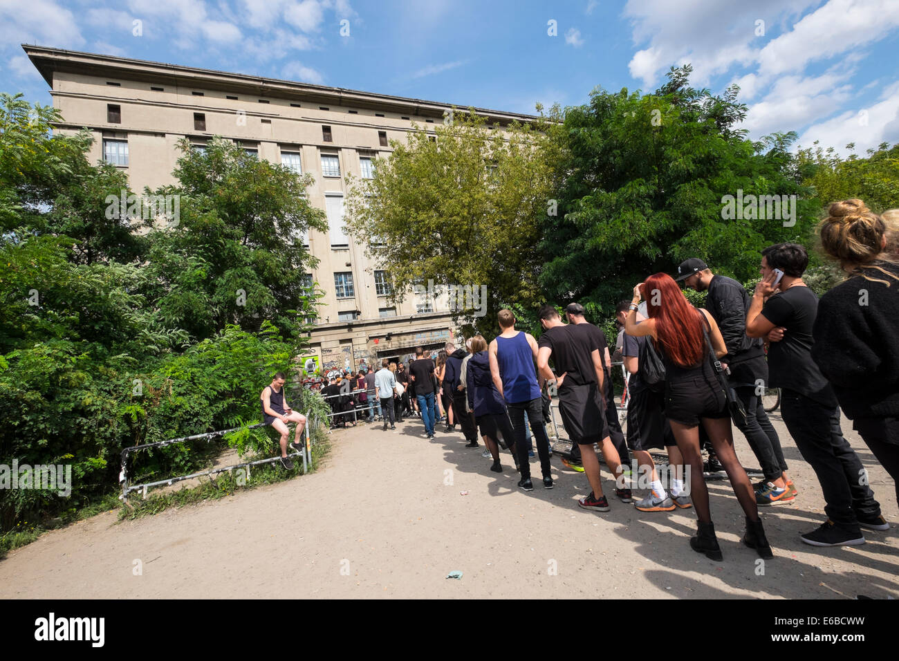Clubbers queuing outside infamous Berghain nightclub on a Sunday afternoon in Berlin Germany Stock Photo
