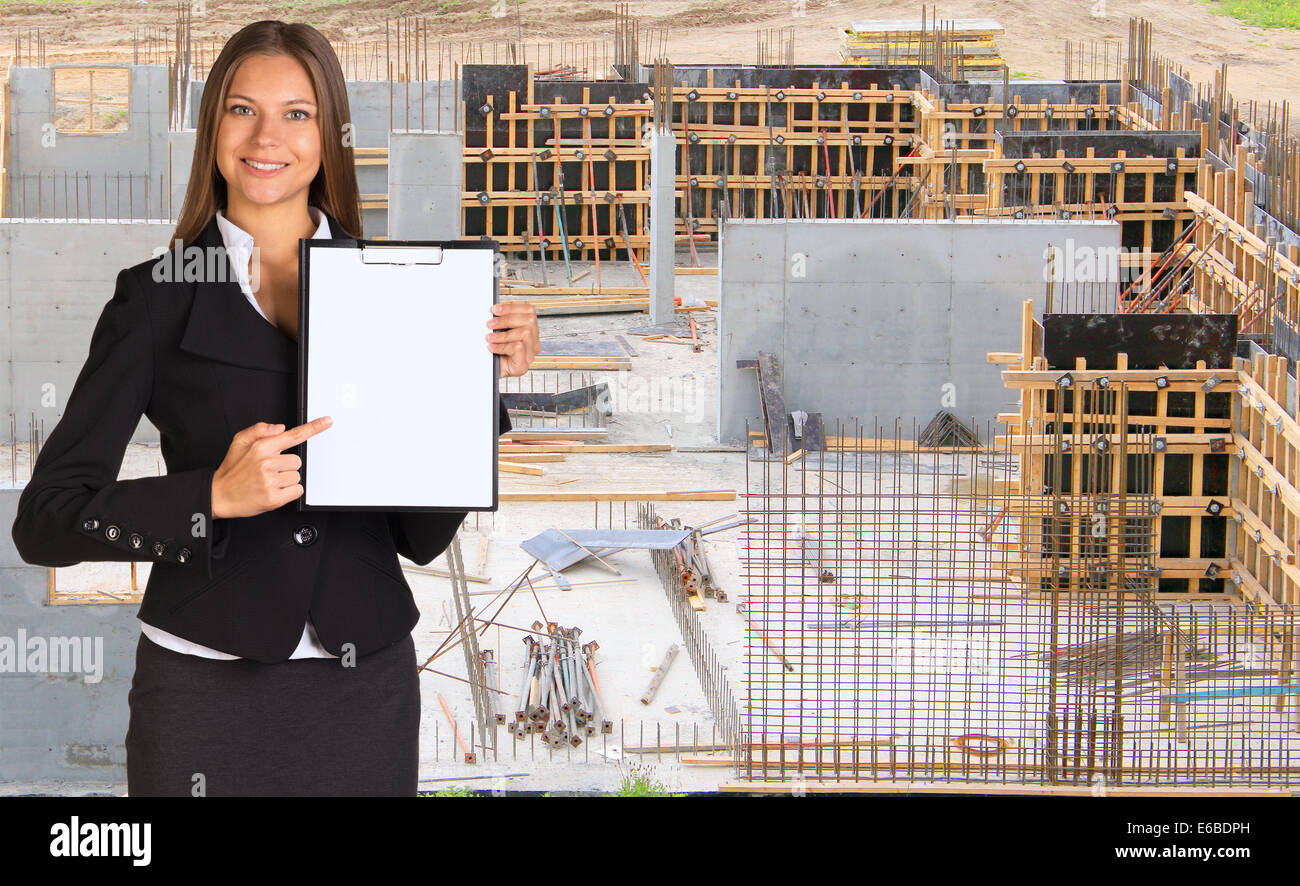 Businesswoman holding paper holder Stock Photo - Alamy