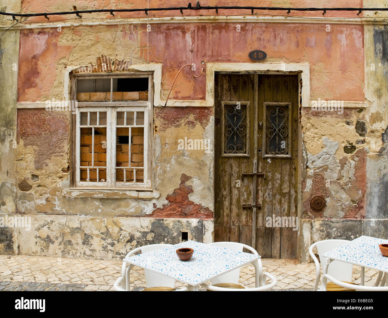 Antique wooden door in a house with worn stone wall texture Stock Photo ...