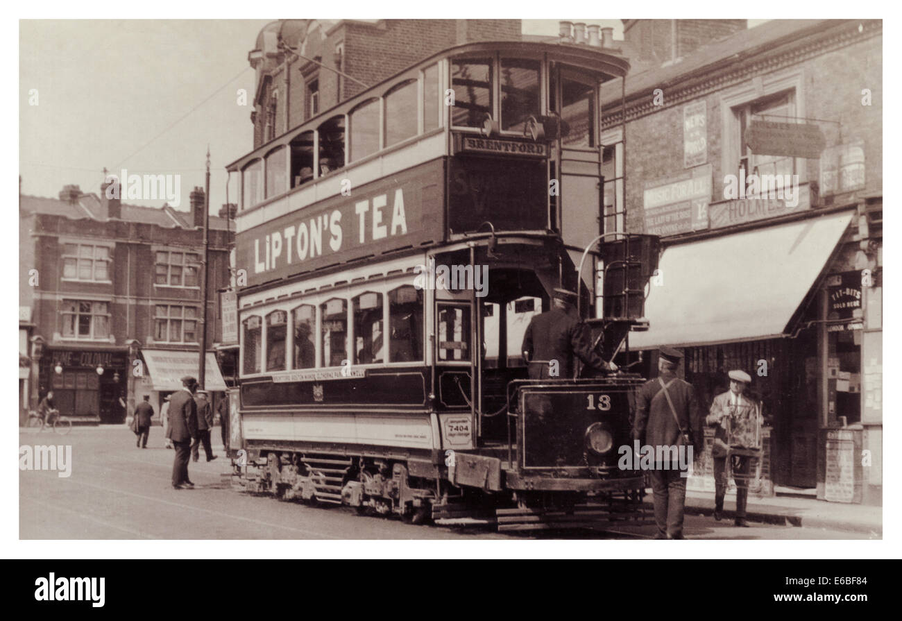 Historic tram with Liptons Tea side banner advertisement in UK High Street Stock Photo