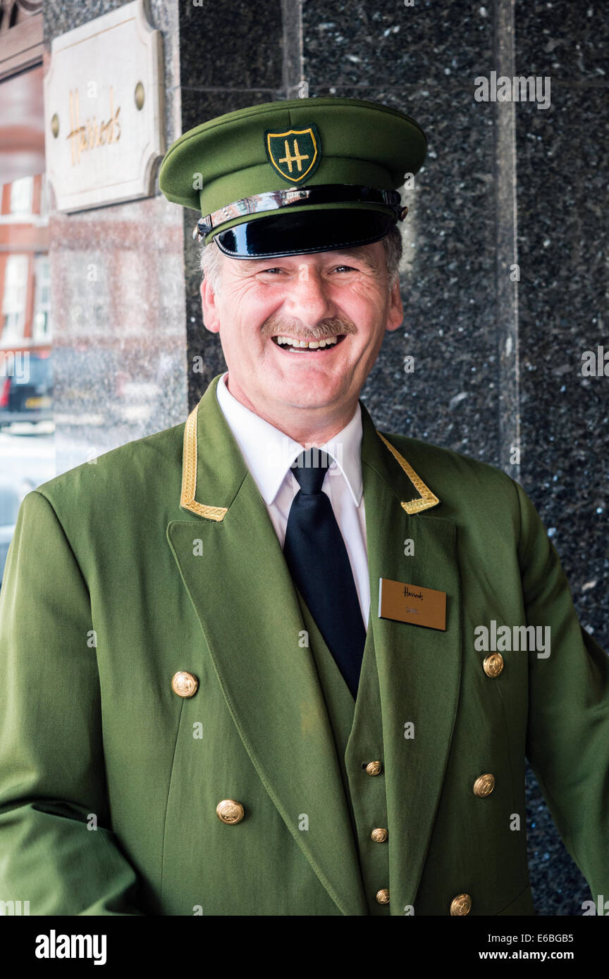 Harrods doorman holding store door open. Knightsbridge, London Stock Photo Alamy
