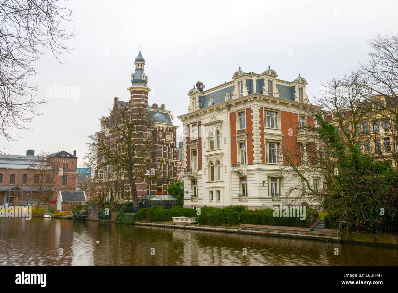 Dutch canals and typical canalside houses in Amsterdam Stock Photo Alamy