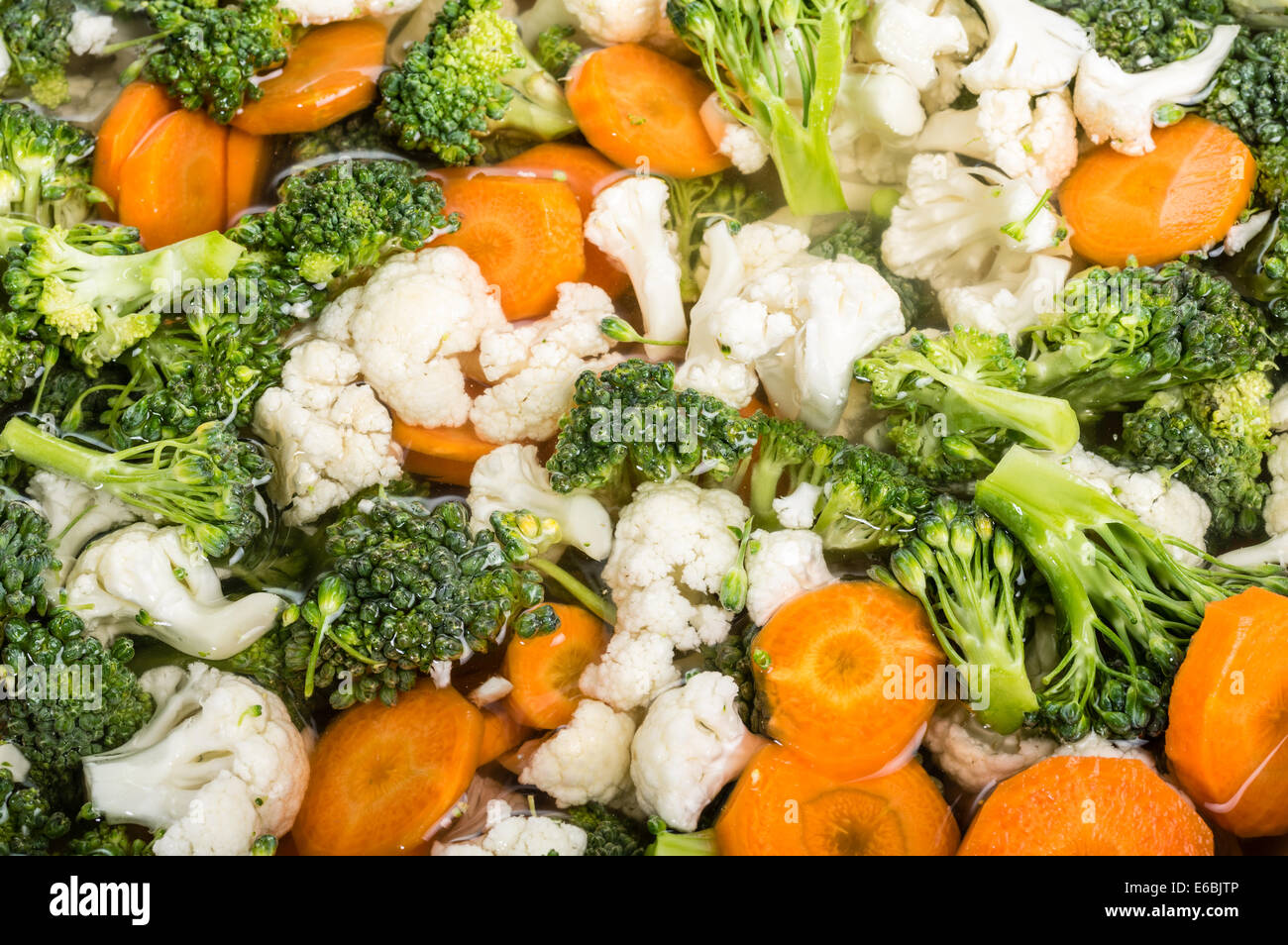 Bowl of fresh cut vegetables in brine for preserving Stock Photo