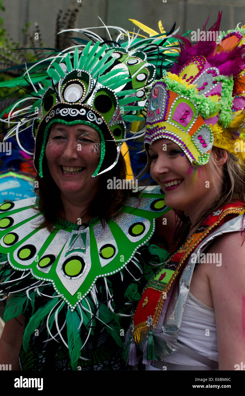 2 women in exotic costumes posing at the Carnival, part of Edinburgh's