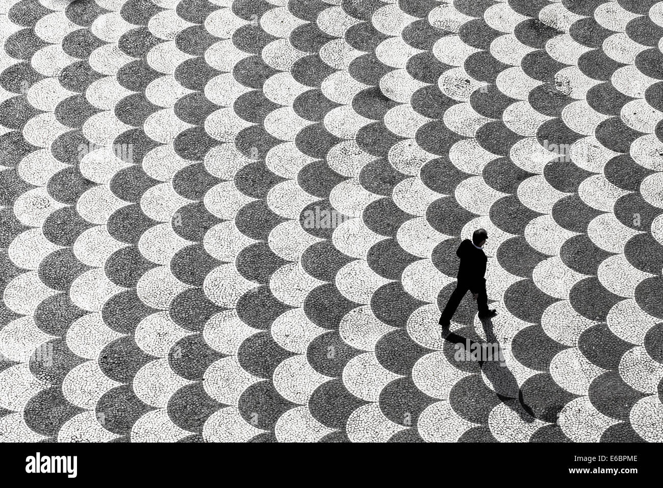 Person seen from above crossing Praca do Municipio square, Funchal, Madeira, Portugal Stock Photo