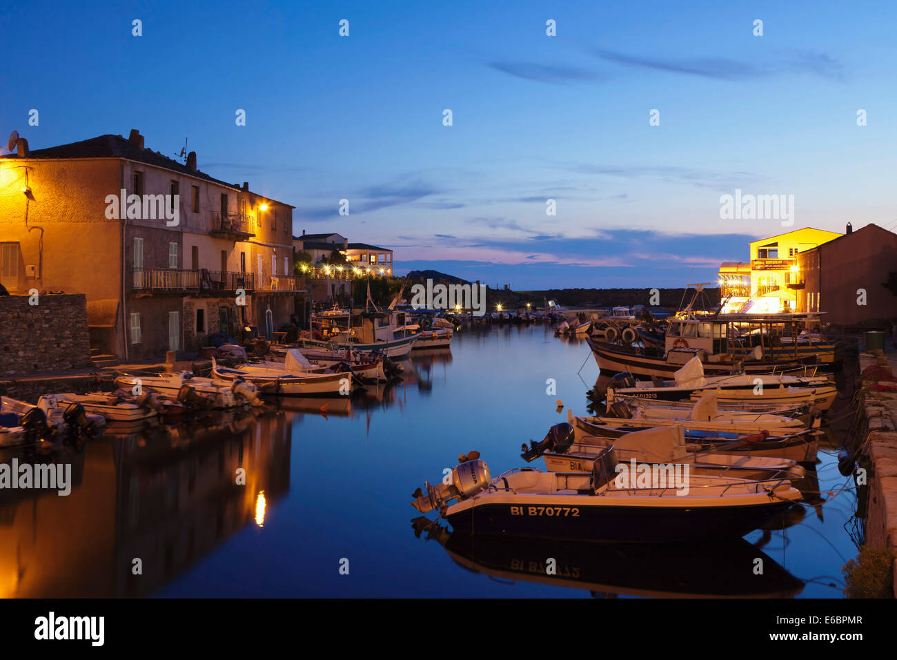 Boats in the harbor at dusk, Port de Centuri, Corsica, France Stock Photo