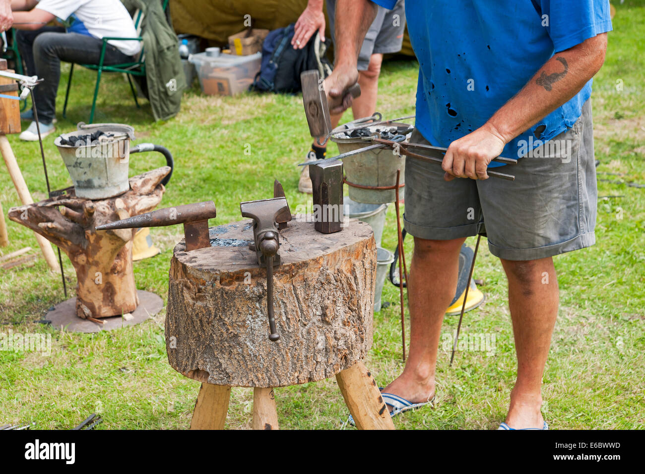 Close up of blacksmith man person working metal at Driffield Show East Yorkshire England UK United Kingdom GB Great Britain Stock Photo