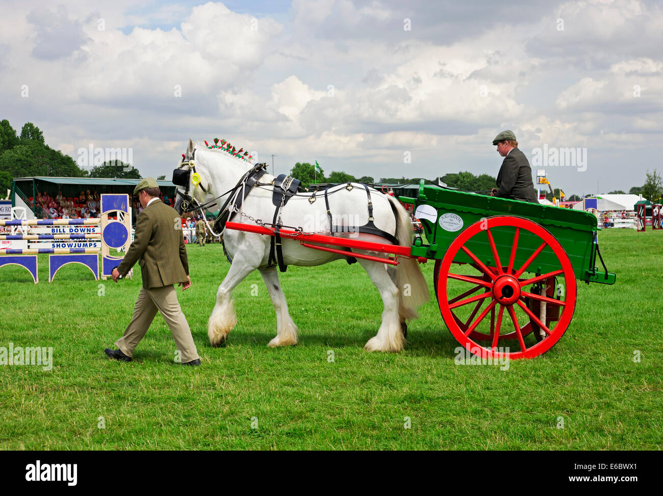 Man leading traditional Horse and cart at Driffield Agricultural Show