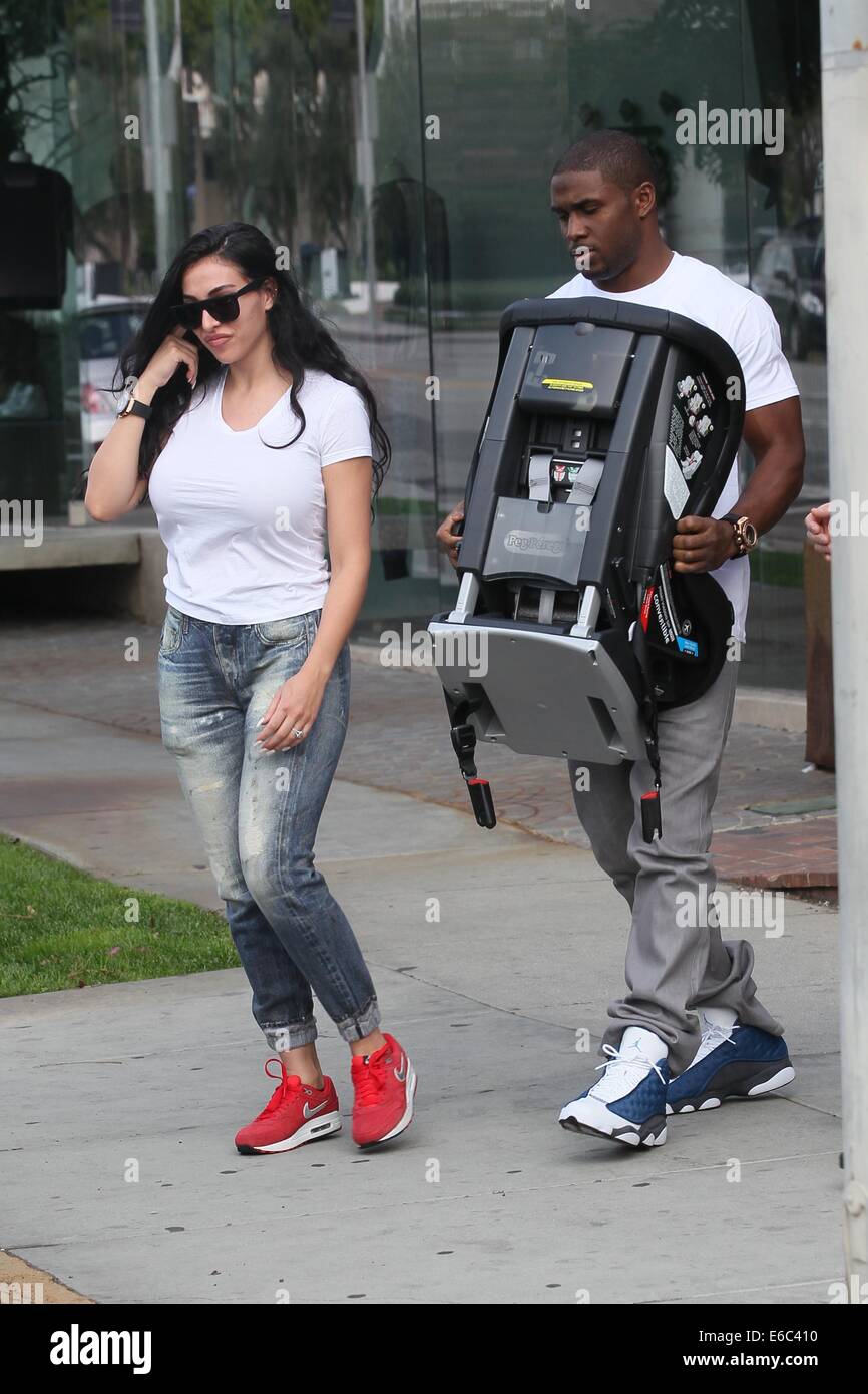 Reggie Bush and Lilit Avagyan shopping at Bel Bambini baby boutique for a car seat  Featuring: Reggie Bush,Lilit Avagyan Where: Los Angles, California, United States When: 04 Feb 2014 Stock Photo