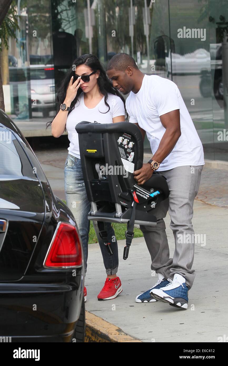 Reggie Bush and Lilit Avagyan shopping at Bel Bambini baby boutique for a car seat  Featuring: Reggie Bush,Lilit Avagyan Where: Los Angles, California, United States When: 04 Feb 2014 Stock Photo