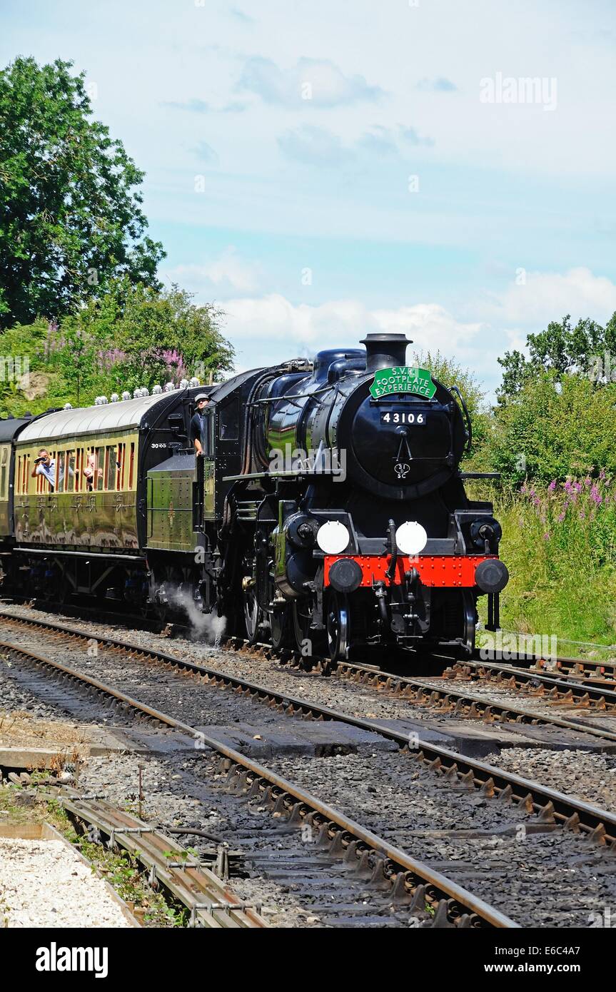 Steam Locomotive Ivatt Class 4 2-6-0 number 43106 in British Rail Black approaching the railway station, Severn Valley Railway, Stock Photo