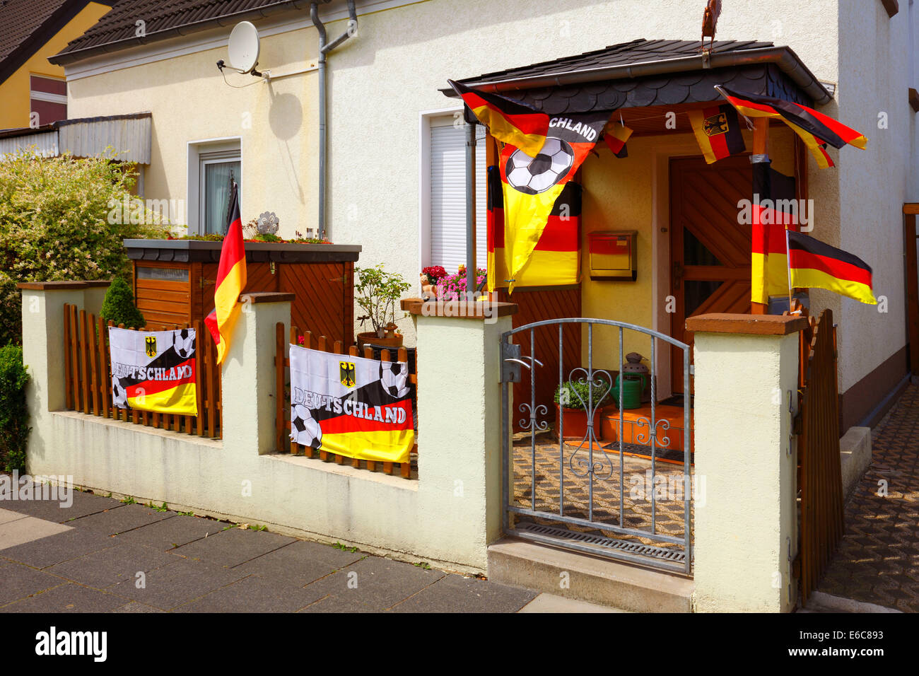 football, 2014 FIFA World Cup Brazil, German national team, national colours, residential house, house entrance of a German football fan decorated with German national flags, D-Muelheim an der Ruhr, Ruhr area, North Rhine-Westphalia, NRW Stock Photo