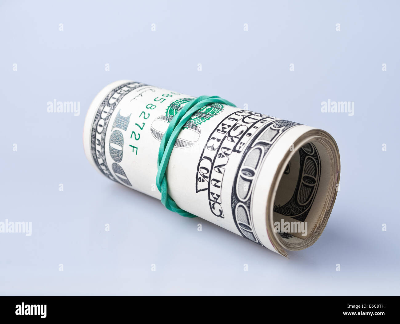 Money roll with US dollars bills Stock Photo