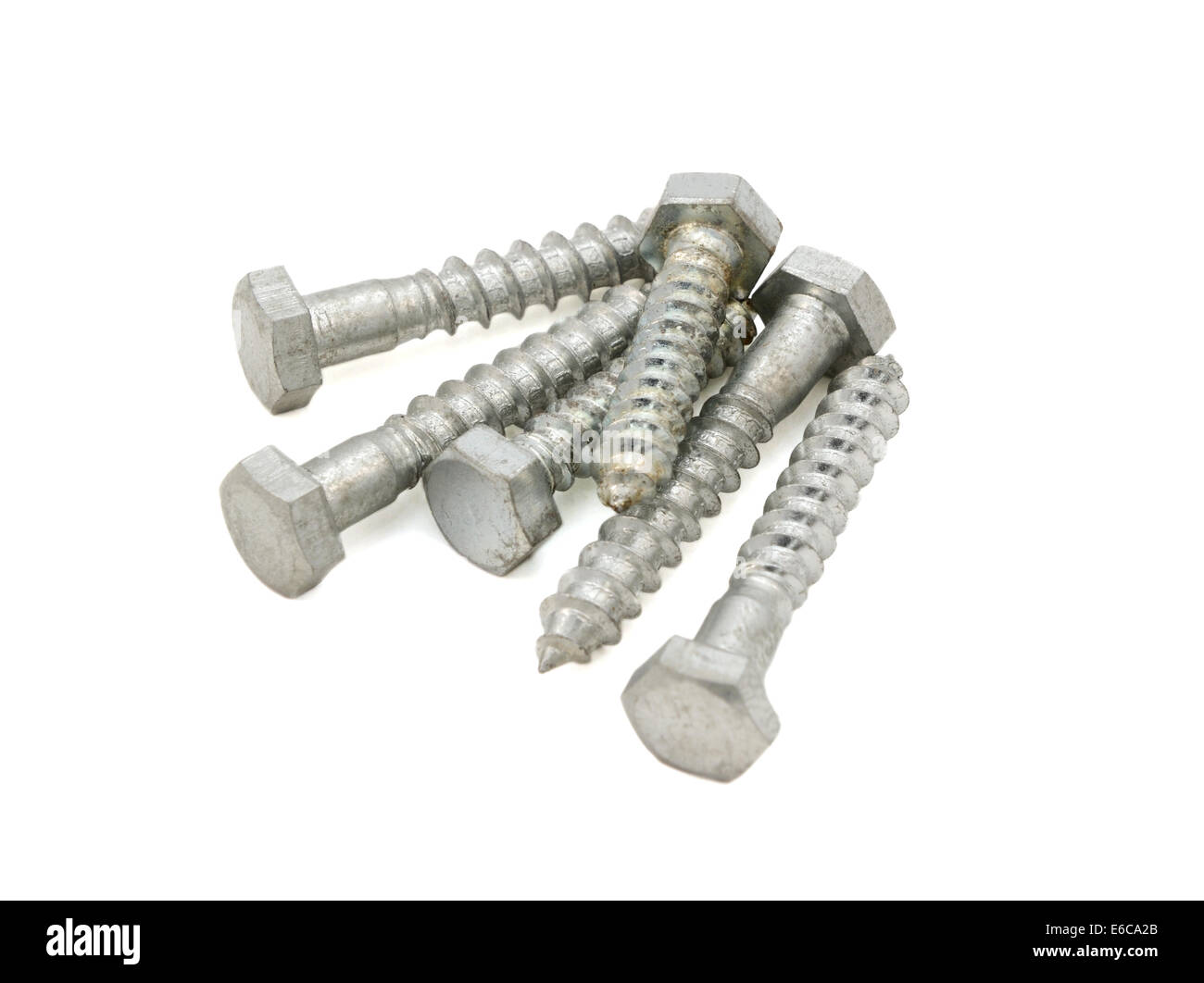Six stainless steel hex bolts, isolated on a white background Stock Photo