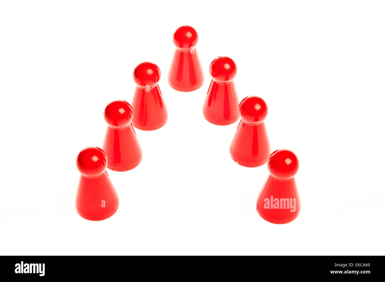 row of seven red counters, teamwork concept Stock Photo