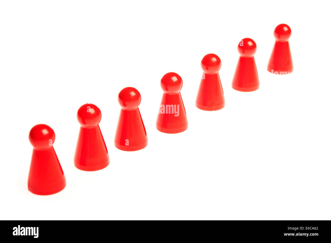 row of seven red counters, teamwork concept Stock Photo