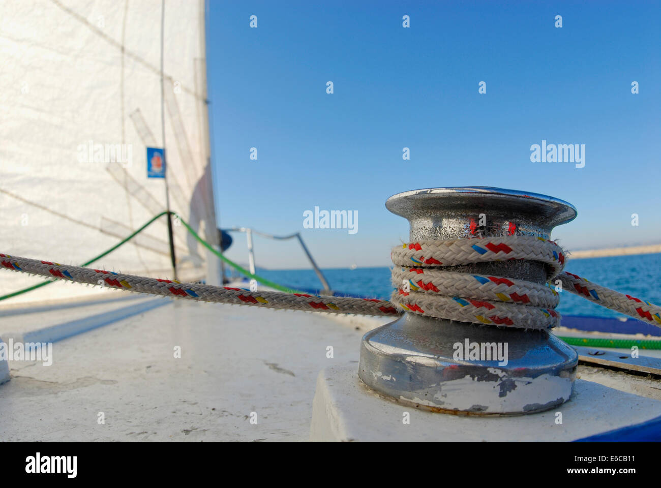 Rope on sail trim (winch) and sails of a yacht in the Mediterranean Sea, France, Europe Stock Photo