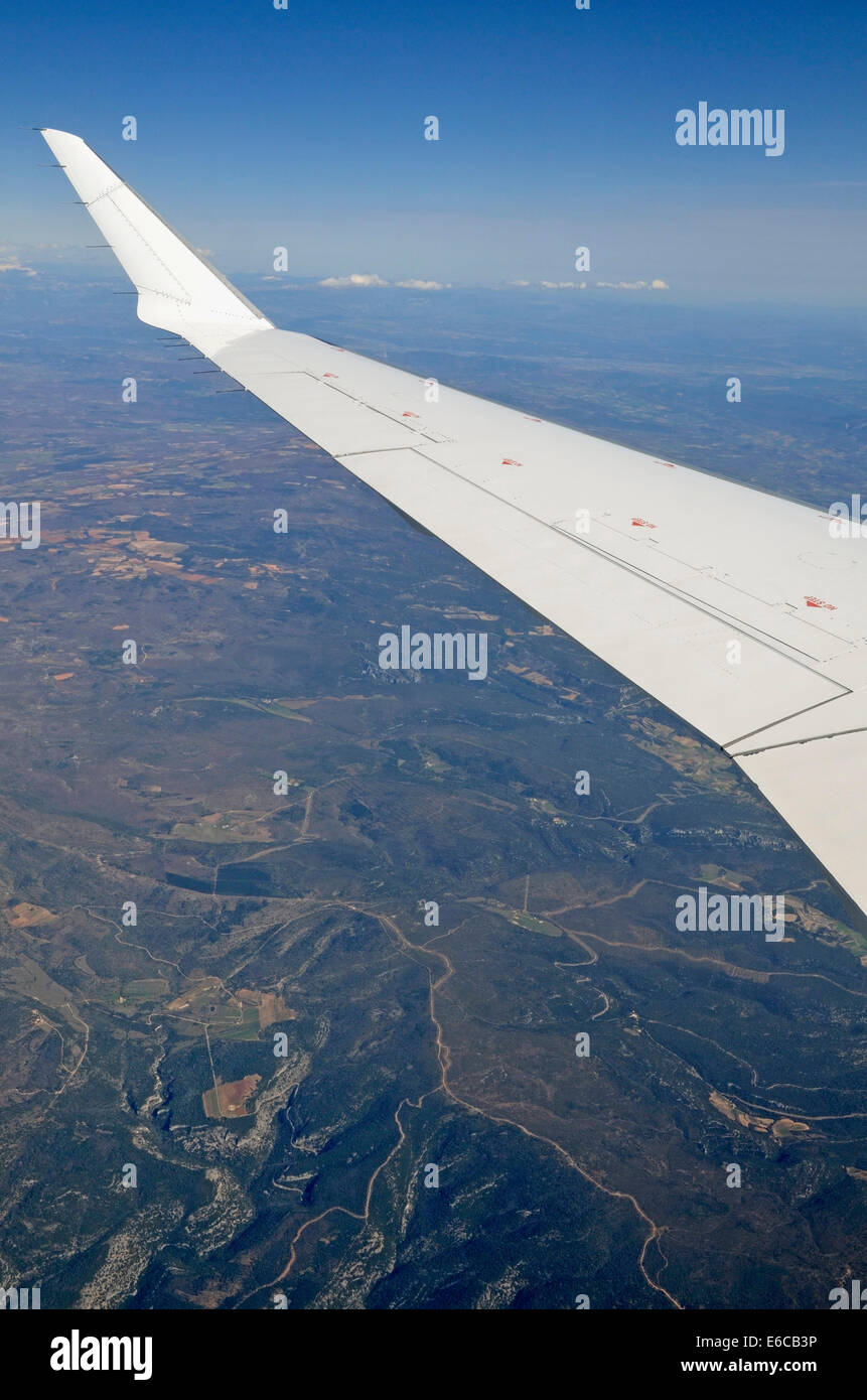 Wing of flying airplane over French Alps, France, Europe Stock Photo Alamy