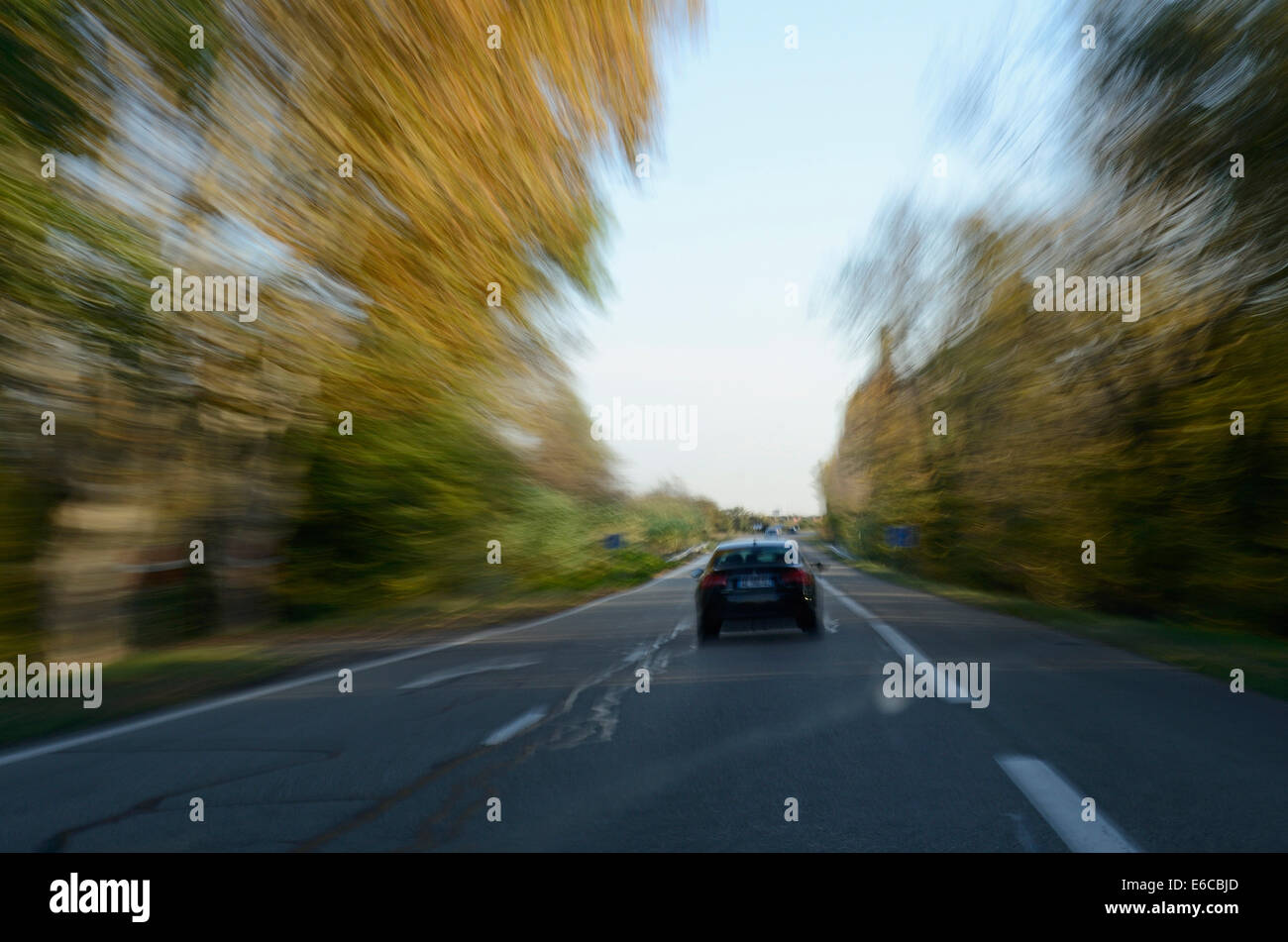 Car driving on a country road Stock Photo