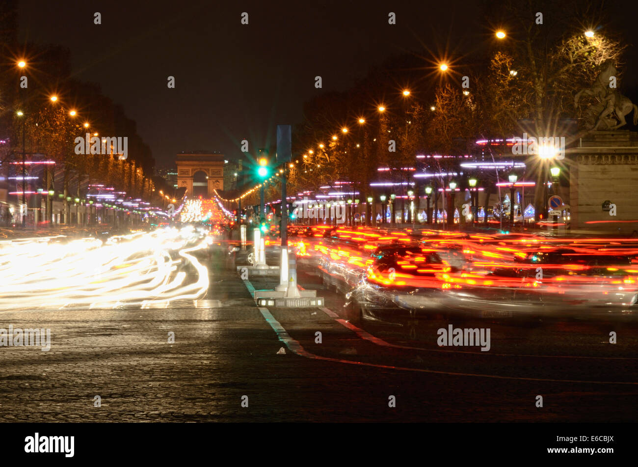 Champs-Elysees and Arc de Triomphe with Christmas lights, by night, Paris, France, Europe Stock Photo