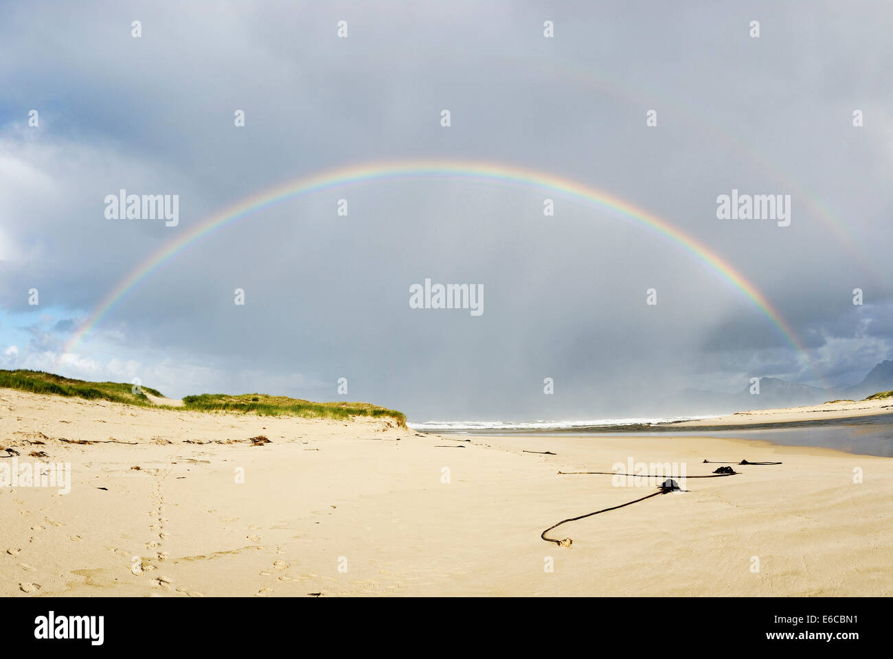 Beach and rainbow, Hermanus beach, South Africa Stock Photo