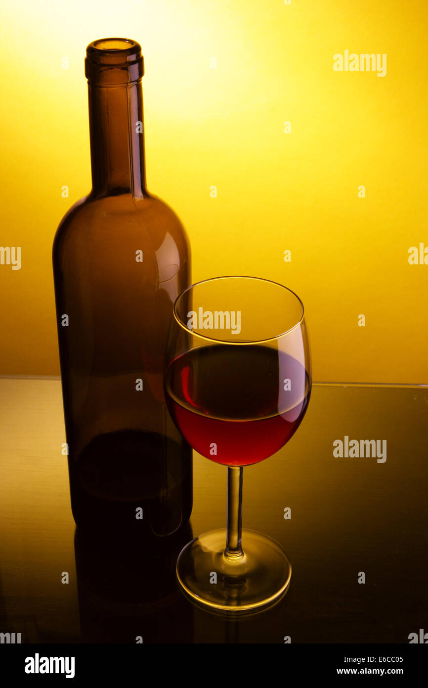 Download Still Life With Glass And Bottle Of Red Wine Over Yellow Background Stock Photo Alamy Yellowimages Mockups