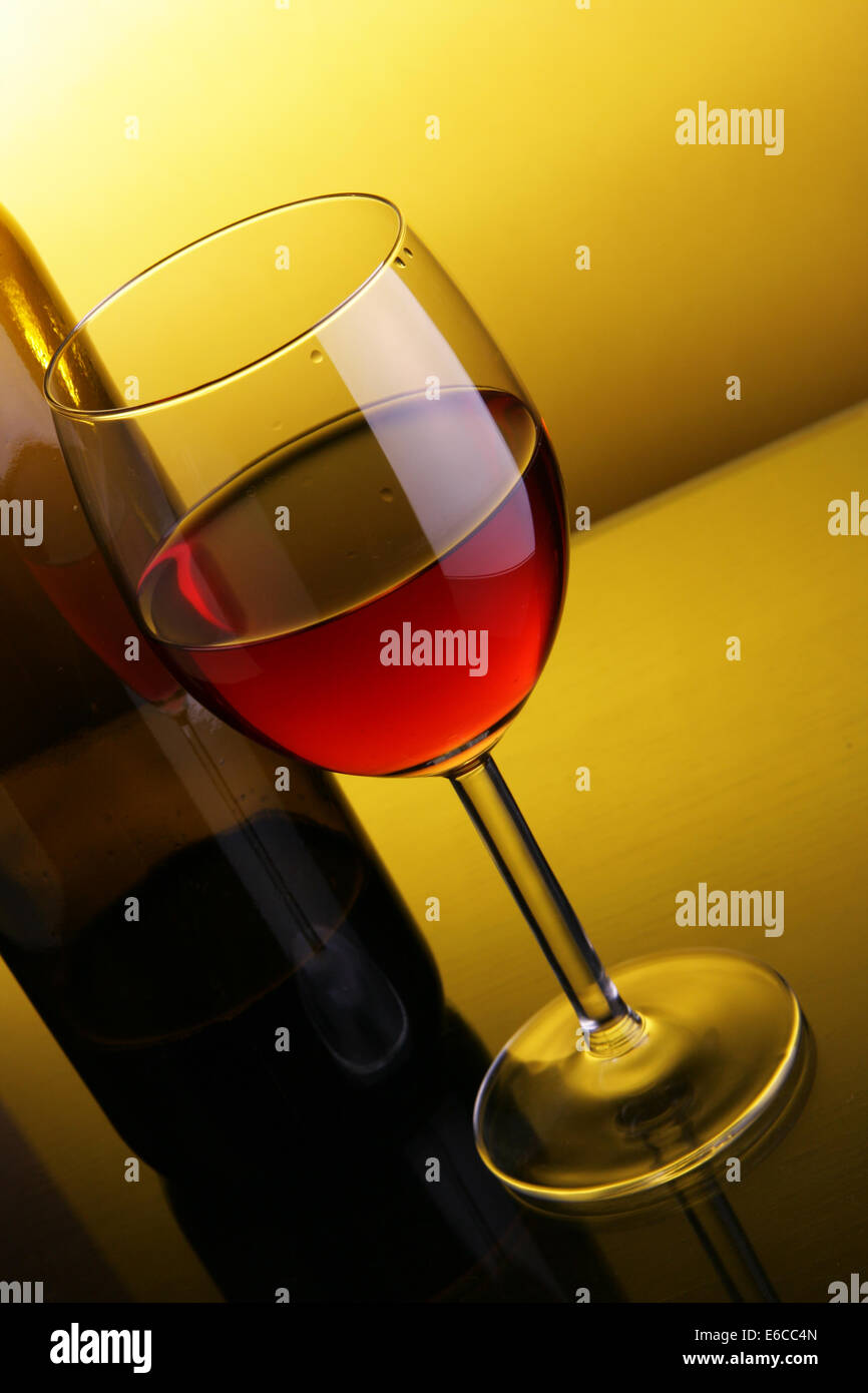 Download Glass Of Red Wine And Bottle Over Yellow Background Stock Photo Alamy Yellowimages Mockups
