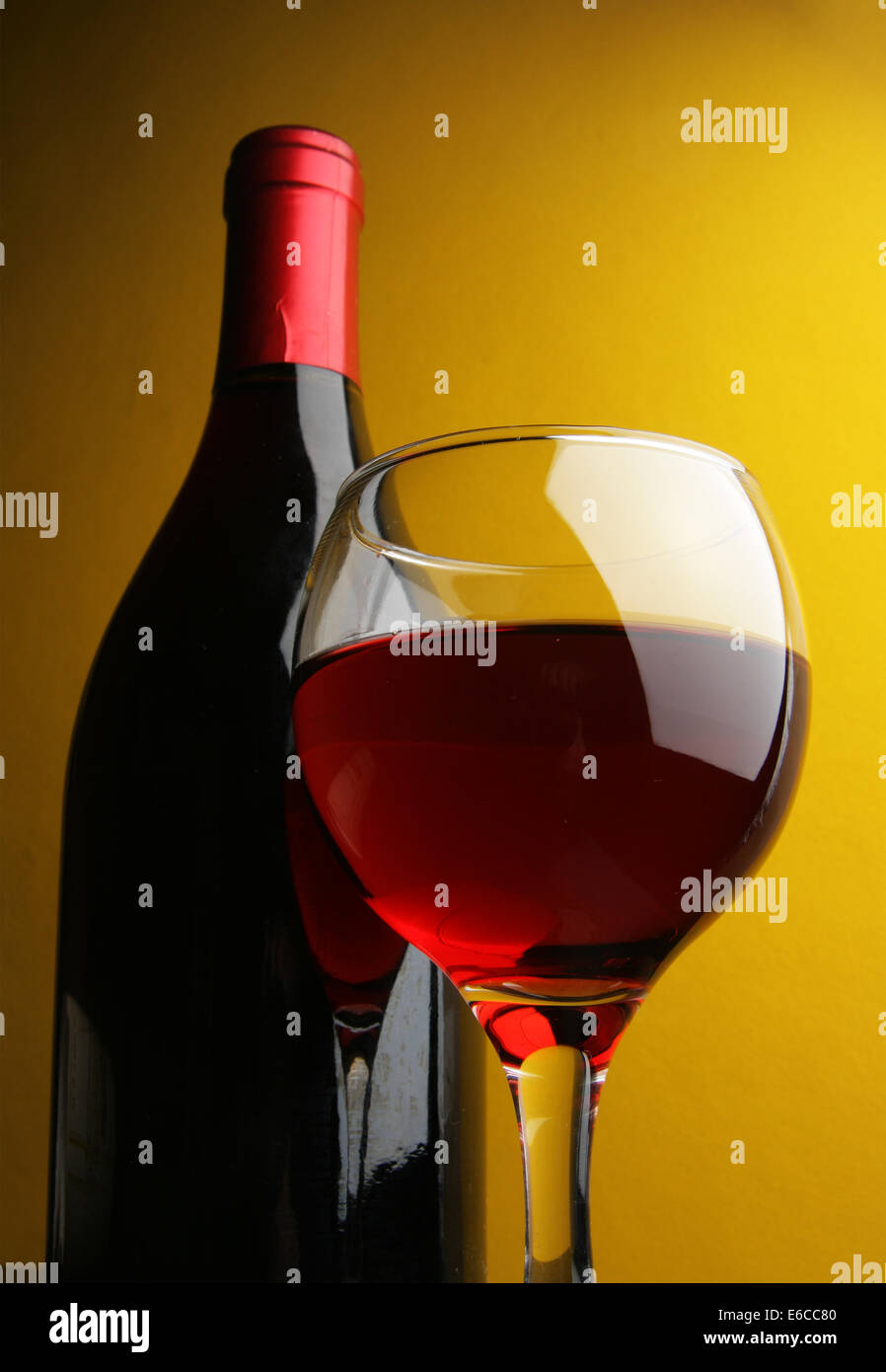 Download Still Life With Glass And Bottle Of Red Wine Over Yellow Background Stock Photo Alamy PSD Mockup Templates
