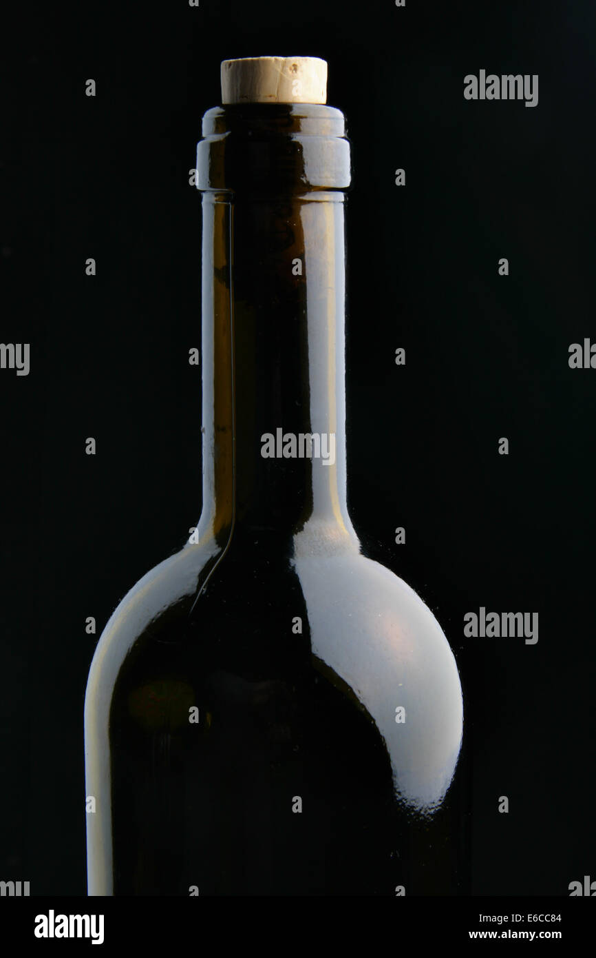 Single corked bottle of red wine over black background Stock Photo Alamy