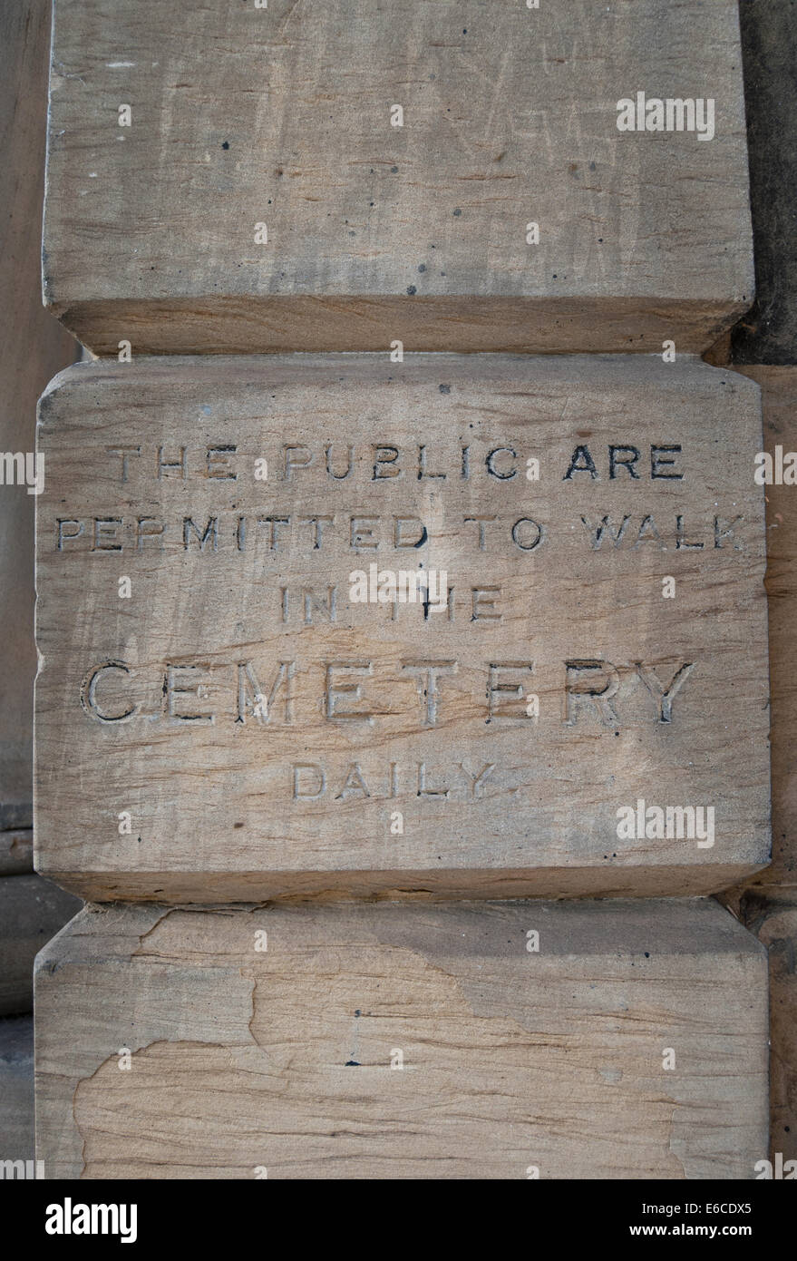 the public are permitted to walk in the cemetery daily, notice etched in entrance wall of  brompton cemetery, london, england Stock Photo
