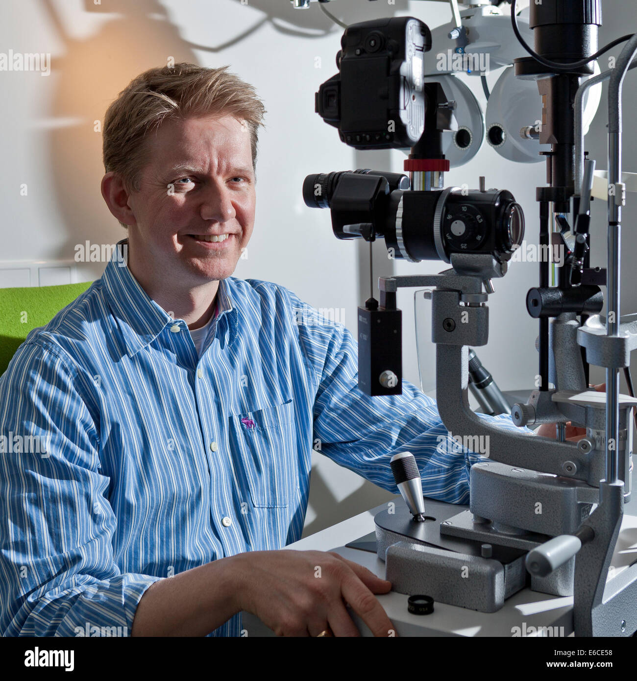 Portrait of doctor with equipment used for Laser (Lasik) eye surgery. Stock Photo