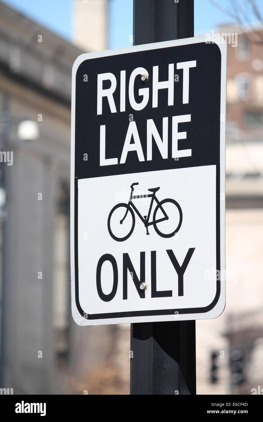 A street sign reading Right Lane Bikes Only Stock Photo