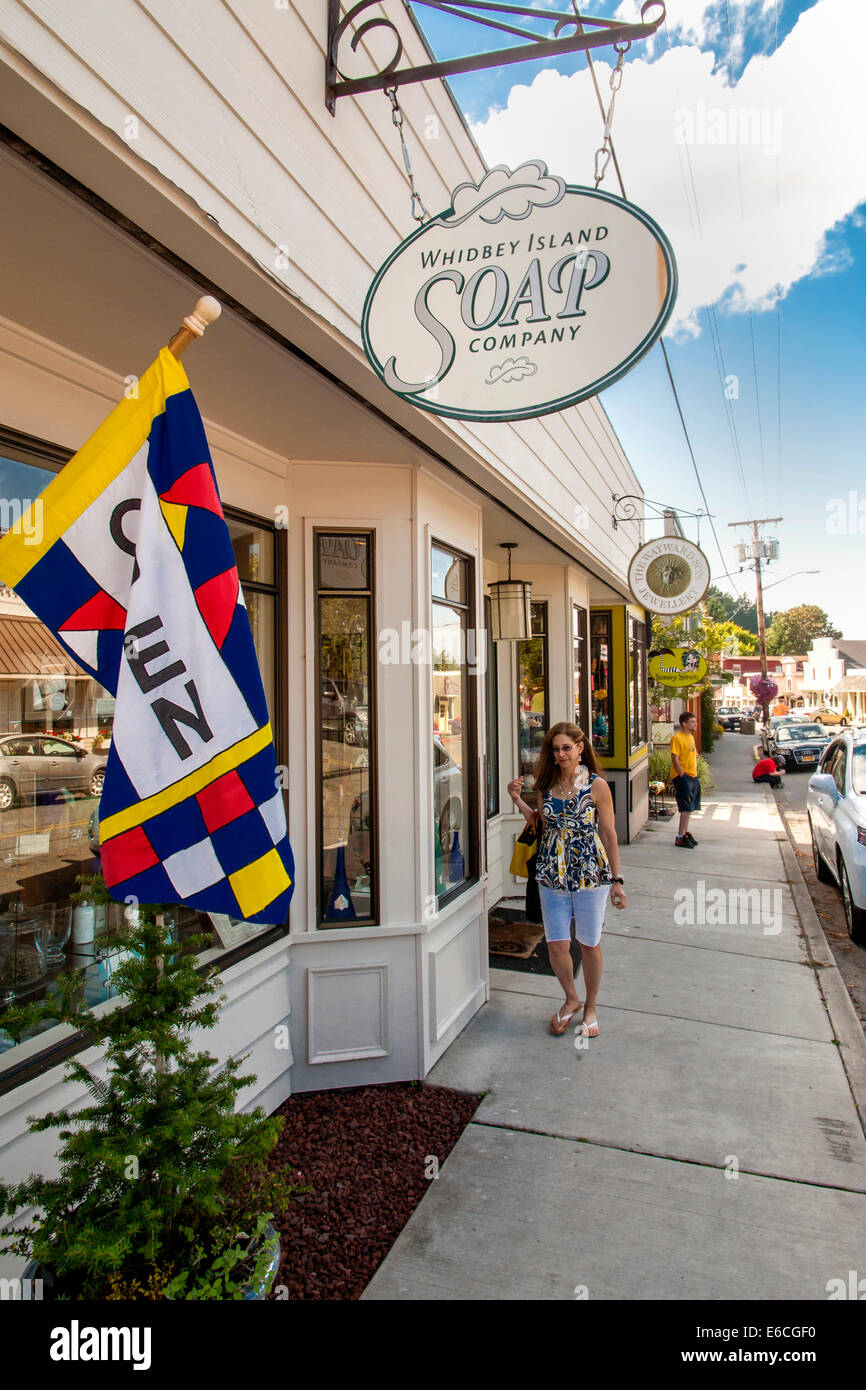 USA, Washington, Whidbey Island, Langley. A woman strolls the shops in