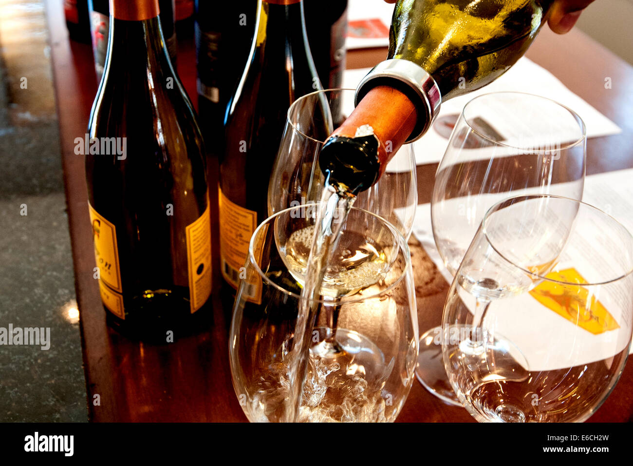 USA, Washington, Woodinville. Pouring wine in one of the many wine