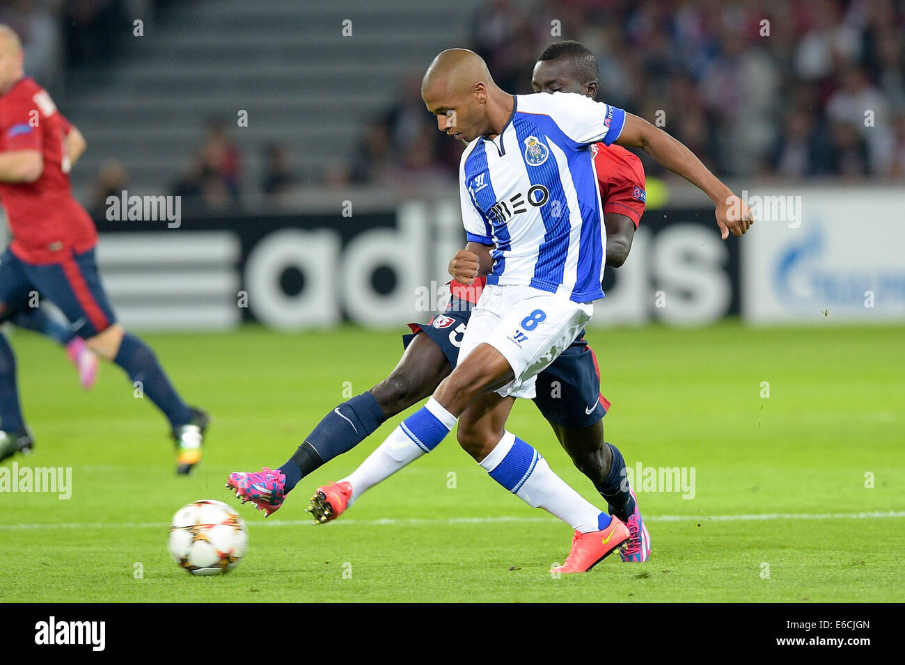 Lille, France. 20th Aug, 2014. UEFA Champions League qualification stages. Lille versus Porto. Idrissa GUEYE (lille) challenged by Yacine Brahimi (Porto) Credit:  Action Plus Sports/Alamy Live News Stock Photo
