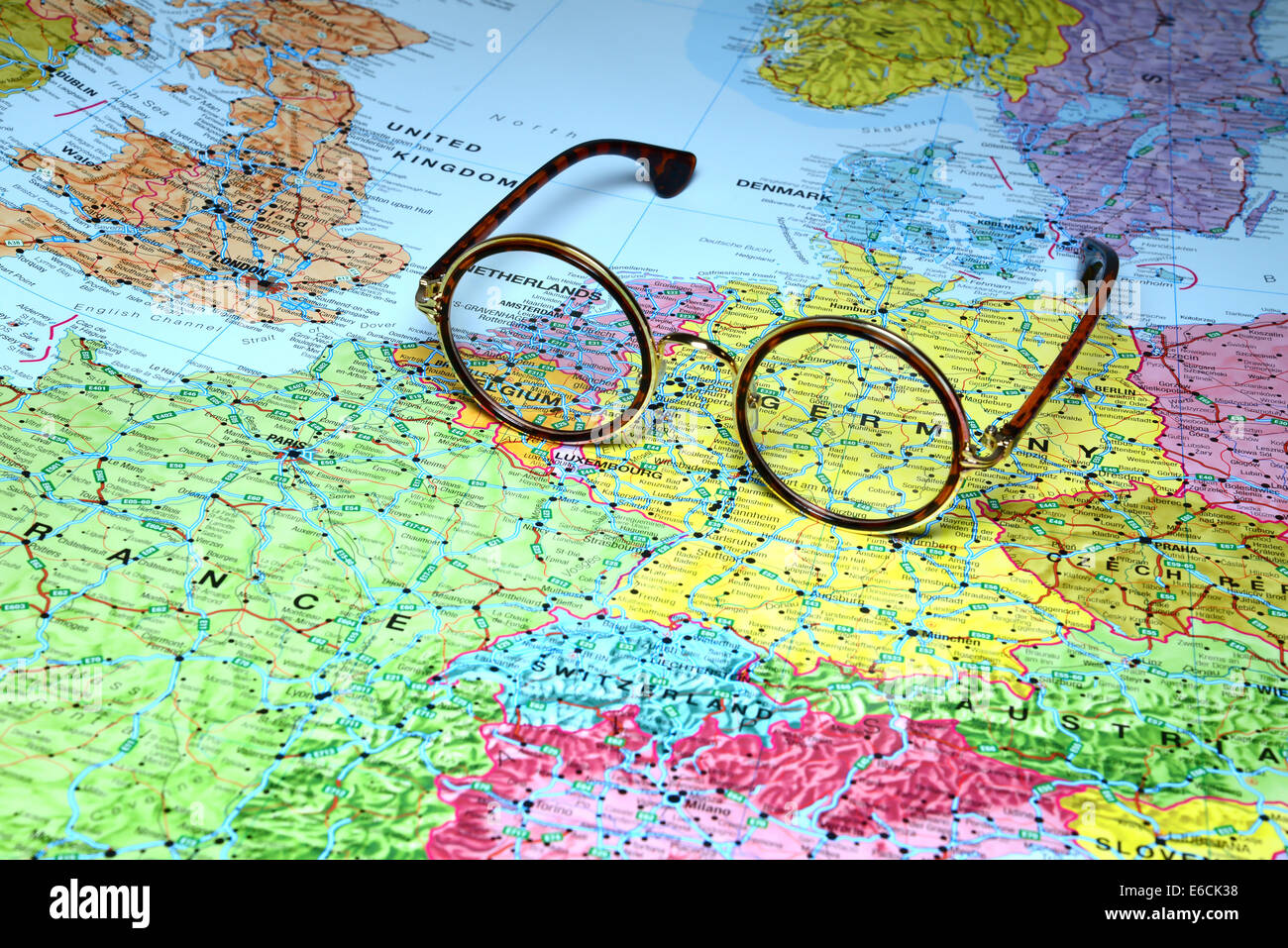 Glasses on a map of europe Germany - Glasses On A Map Of Europe Germany E6CK38 